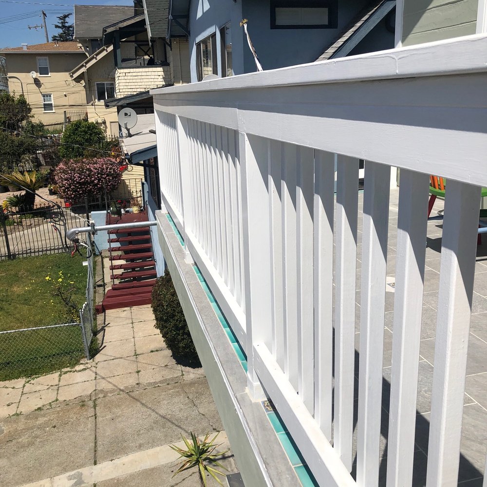 Millers Builders - a view of a house from a balcony - Fences & Gates Near Me