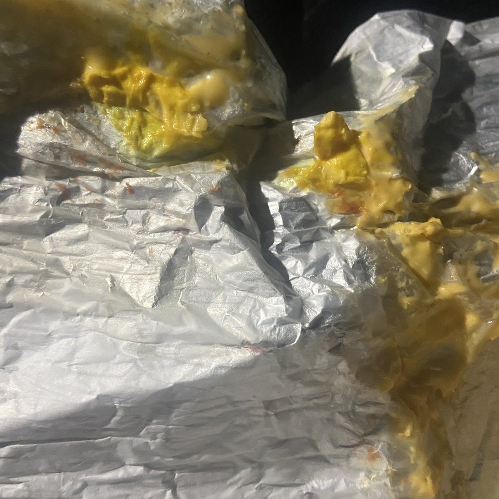 Wendy's - a half eaten sandwich on aluminum foil - Fast Food Near Me - Colonial Heights, Virginia Wendy's - a half eaten sandwich on aluminum foil - Fast Food Near Me - Colonial Heights, Virginia