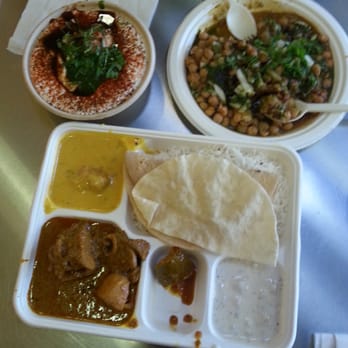 Vik's Chaat - Clockwise from top left: dahl pakori, aloo tikki, lamb curry - Indian Near Me - Berkeley, California Vik's Chaat - Clockwise from top left: dahl pakori, aloo tikki, lamb curry - Indian Near Me - Berkeley, California