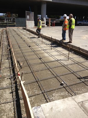 Concrete - Demolished existing asphalt , installed new base materials, compacted and re asphalted and poured concrete curbs for a transit terminal