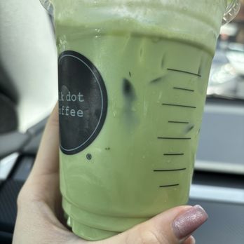 Blk Dot Coffee - a hand holding a cup of green tea - Coffee & Tea Near Me - Newport Beach, California