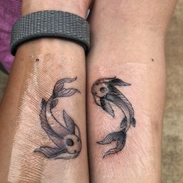 Couple's tattoo: Tui & La from ATLA (photo taken right after completion) Couple's tattoo: Tui & La from ATLA (photo taken right after completion)
