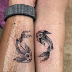 Tried & True Tattoo Kauai - Couple's tattoo: Tui & La from ATLA (photo taken right after completion)