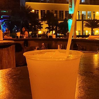 Riptides Grill And Tiki Bar - a drink in a plastic cup - Tiki Bars Near Me - Fort Walton Beach, Florida Riptides Grill And Tiki Bar - a drink in a plastic cup - Tiki Bars Near Me - Fort Walton Beach, Florida