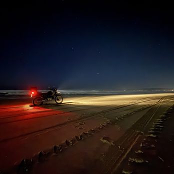 Oceano Dunes State Vehicular Recreation Area  - Dirt bike along the shoreline at night - Parks Near Me - Oceano, California