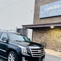 Sam's Limo - Luxury Cadillac Escalade taking care of VIP clients