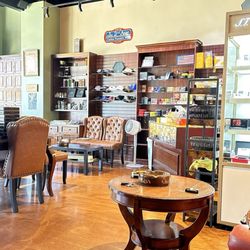 Genuine Cigars - Tobacconist Nick tom the left in his high quality Cigar Lounge.
