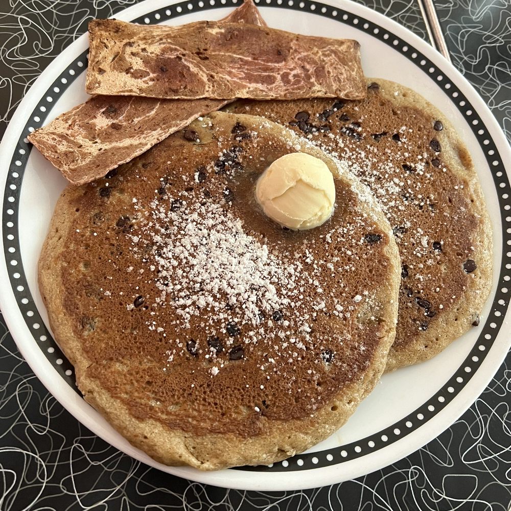 Spiral Diner & Bakery - Two step: chocolate chip pancakes and bacon - Bakeries Near Me - Fort Worth, Texas Spiral Diner & Bakery - Two step: chocolate chip pancakes and bacon - Bakeries Near Me - Fort Worth, Texas