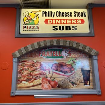 Fratellos Pizza Ucf - a sign for a restaurant - Pizza Near Me - Orlando, Florida Fratellos Pizza Ucf - a sign for a restaurant - Pizza Near Me - Orlando, Florida