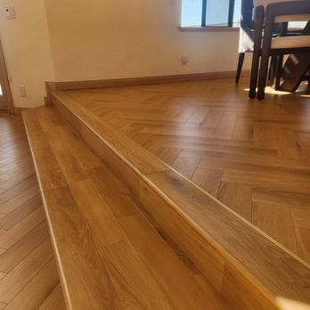 Ground Up Flooring - Matching flushing stairs with gold metal accent instead of caulking. - Flooring Near Me Ground Up Flooring - Matching flushing stairs with gold metal accent instead of caulking. - Flooring Near Me