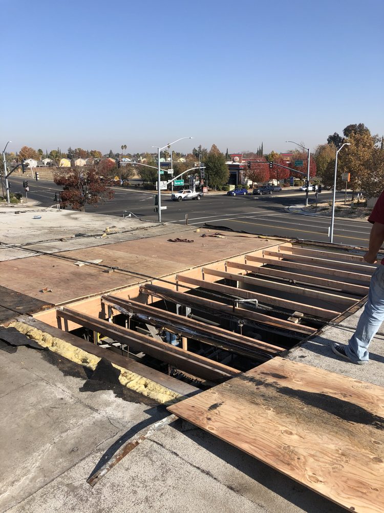 Slide of New Era Roofing