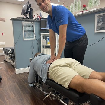 True Vine Chiropractic - Dr. Kevin and my husband! "Cracks" - Chiropractors Near Me - Jupiter, Florida