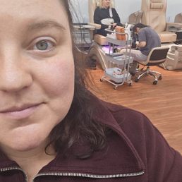 My friend taking a selfie while I'm getting my toes done. (She got her nails done and was very satisfied!) My friend taking a selfie while I'm getting my toes done. (She got her nails done and was very satisfied!)