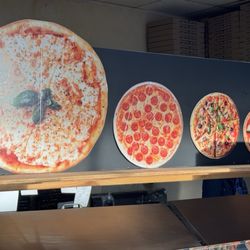 Dimoran Pizza & Deli - Look at the sizes of their pizzas. The largest one requires a huge car or suv to bring home. You been warned.
