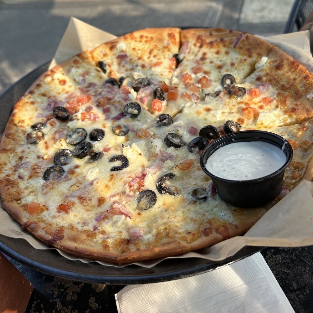 The Treehouse - a pizza with olives and cheese - Pubs Near Me - Cleveland, Ohio The Treehouse - a pizza with olives and cheese - Pubs Near Me - Cleveland, Ohio