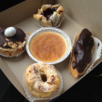 La Gourmandise - from left: meringue with hazelnut in center coated in chocolate - berry tart thing - eclaire - puff pastry thing (helpful, eh?) - Caterers Near Me - Ottawa, Ontario La Gourmandise - from left: meringue with hazelnut in center coated in chocolate - berry tart thing - eclaire - puff pastry thing (helpful, eh?) - Caterers Near Me - Ottawa, Ontario