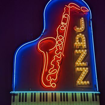 American Jazz Museum - a neon sign of a saxophone - Performing Arts Near Me - Kansas City, Missouri American Jazz Museum - a neon sign of a saxophone - Performing Arts Near Me - Kansas City, Missouri
