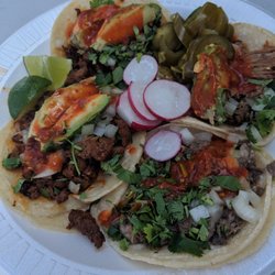 Los Amigos Meat Market - Four tacos. Excellent prices, legit Mexican style tacos.