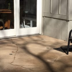 Affordable Mudjacking Concrete Lifting - This patio was raised around 3 to 4 inches to get positive drainage away from the foundation.