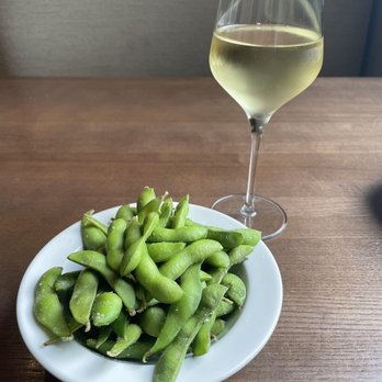 Saketumi - Edamame and a glass of Pinot Grigio. - Japanese Near Me - Rehoboth, Delaware Saketumi - Edamame and a glass of Pinot Grigio. - Japanese Near Me - Rehoboth, Delaware