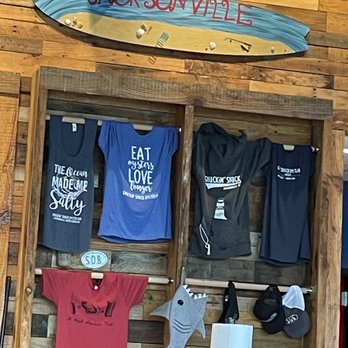 Shuckin' Shack Oyster Bar -  - shirts on display - Seafood Near Me - Jacksonville, North Carolina