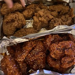 a tray of fried chicken and a tray of fried chicken