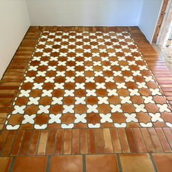 Fuentes Tile LLC - Clay tiles made in Mexico, the tiles were installed at a main entrance making a frame in the shape of a mat.