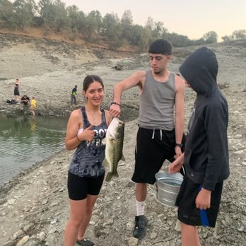 Lake Amador Resort - Youngest daughter Azia with her very first fish.  She pulled it in all by herself, just wouldn't hold it lol - Hotels Near Me - Ione, California