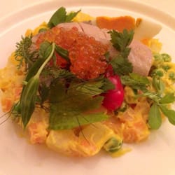 Russian salad with salmon roe and smoked trout