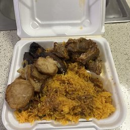 Pork with Yellow rice , fried plantains and potatoes Pork with Yellow rice , fried plantains and potatoes