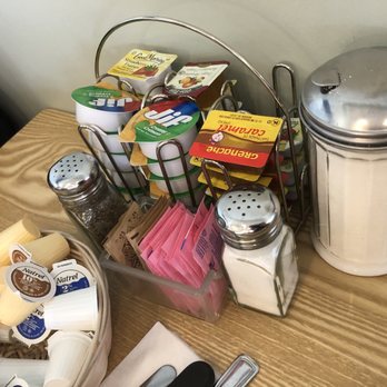 Eggspress - a variety of condiments on a table - Breakfast & Brunch Near Me - Dorval, Quebec