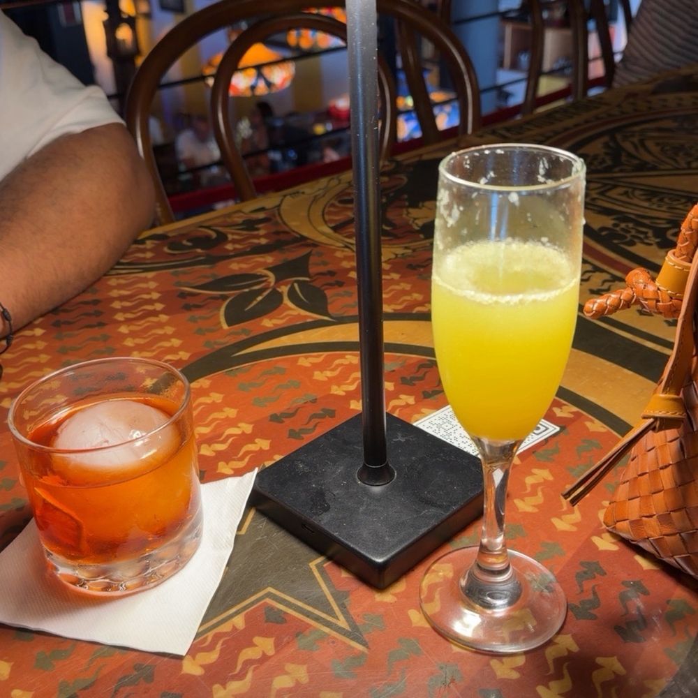 The Negroni AM + orange juice mimosa