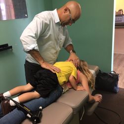Michael S. Wasserstrom, DC - Premier Family Chiropractic - Dr. Mike delivering a "double adjustment!"