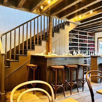 Chez Nous - Bar area on Main Floor. Steps lead up to second level with tables. - French Near Me - Charleston, South Carolina