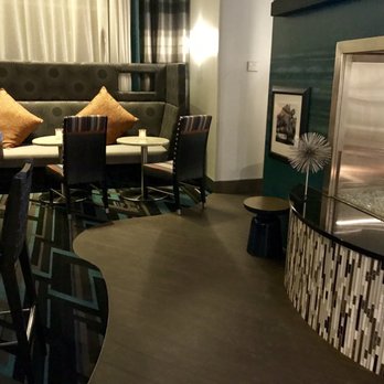 Hampton Inn & Suites Herndon-Reston - Sitting area with fireplace - Hotels Near Me - Herndon, Virginia Hampton Inn & Suites Herndon-Reston - Sitting area with fireplace - Hotels Near Me - Herndon, Virginia