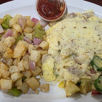Renae's Cafe - Hottie Skillet (Jalepenos, Hot Links, Pineapple and topped with pepper jack cheese) with country potatoes. - American Near Me - Bakersfield, California
