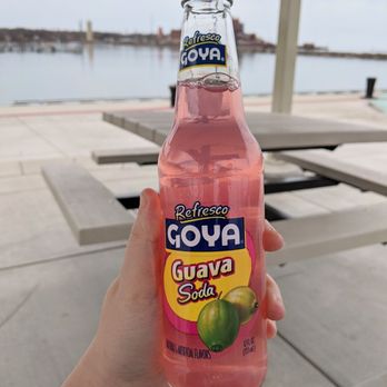 Taqueria Mexicana - a person holding a bottle of guava - Mexican Near Me - Dunkirk, New York Taqueria Mexicana - a person holding a bottle of guava - Mexican Near Me - Dunkirk, New York