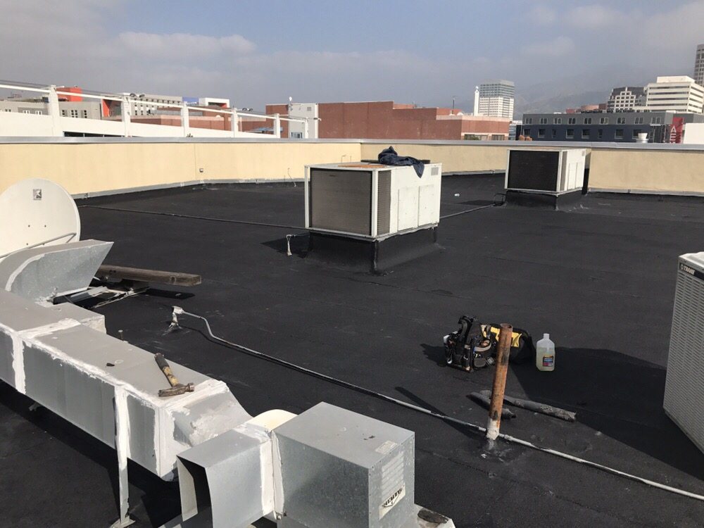 Slide of H&M ROOFING