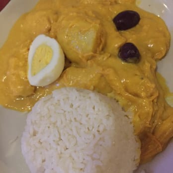 Chalan on the Beach - Aji de Gallina (shredded chicken in a cheese and cream sauce) with rice, potatoes, a hard boiled egg and two olives - Latin American Near Me - Miami Beach, Florida