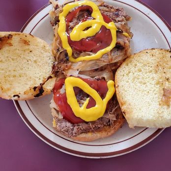 Powers Hamburgers - a sandwich with mustard and ketchup - Burgers Near Me - Fort Wayne, Indiana
