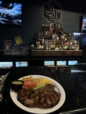 Photo of JJ's Sports Bar - Highland, CA, US. New york steak plate with rice and beans