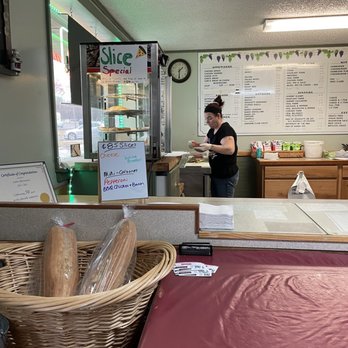Carm's - a woman at a counter in a restaurant - Pizza Near Me - Scotia, New York Carm's - a woman at a counter in a restaurant - Pizza Near Me - Scotia, New York