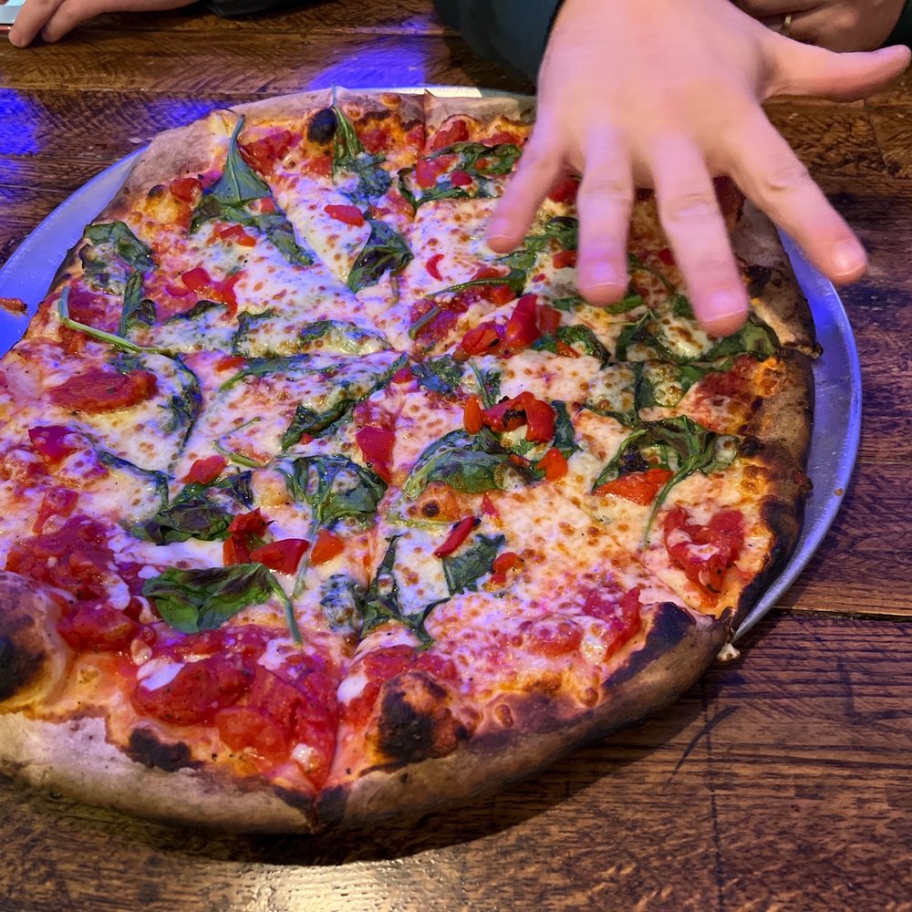 Goodman's American Pie - a child reaching for a pizza - Pizza Near Me - Ludlow, Vermont Goodman's American Pie - a child reaching for a pizza - Pizza Near Me - Ludlow, Vermont