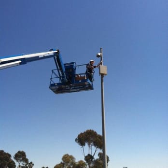 Layer3 Security Services - One of our team members inspecting a new camera installed at the Border between the US and Mexico - Security Systems Near Me - San Diego, California