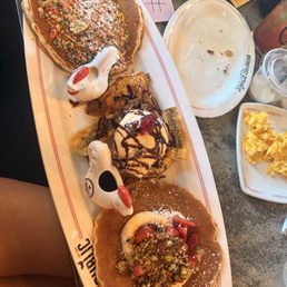 Rooster flight with Milk & Cereal Pancakes Banana Split French Toast Tres Leches Vegan Pancakes