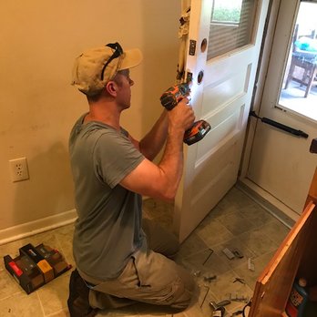 Currituck Remodelers - a man working on a door - General Contractors Near Me Currituck Remodelers - a man working on a door - General Contractors Near Me