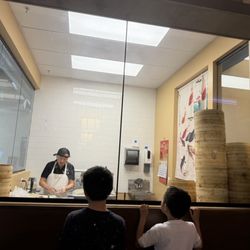 Kids watching the dumplings being made