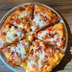 Mini pizza. Extra cheese and bacon.