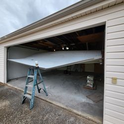 Mid County Garage doors - Hanging by the cables and opener
