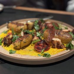 Gemini - OCTOPUS A LA PLANCHA fingerling potatoes, saffron aioli, grilled red onion, roasted tomato, pimenton